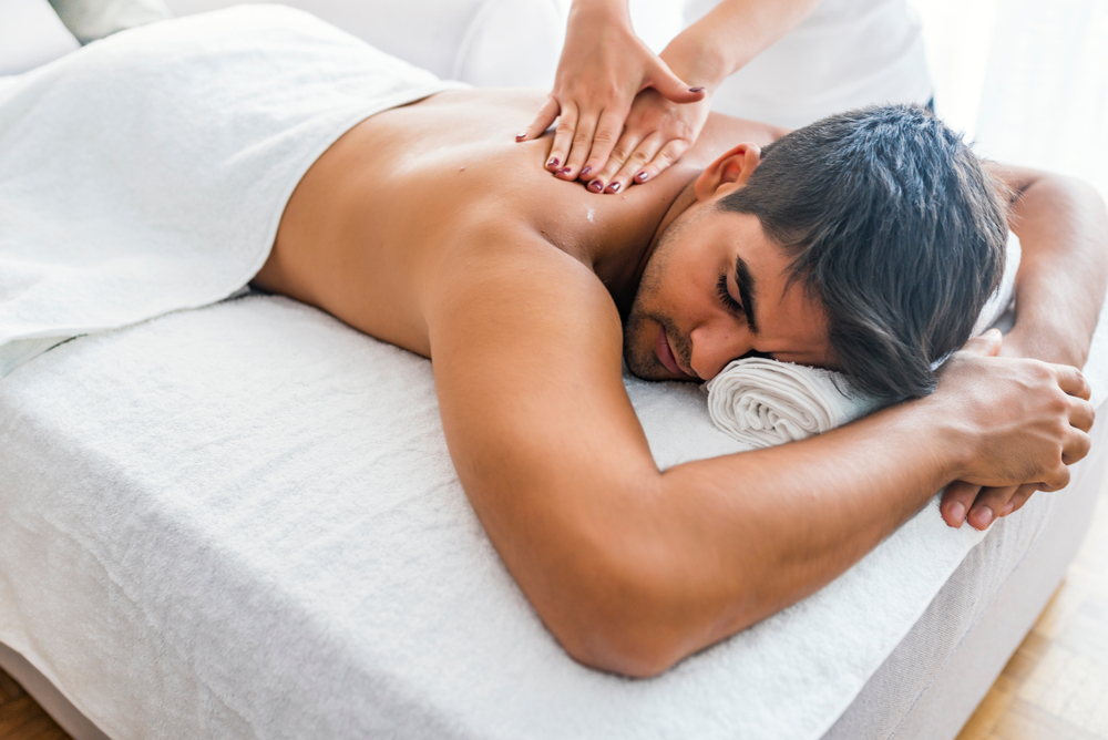 Man,Having,Massage,In,Spa,Salon,,Closeup.,Sports,Massage.,Massage